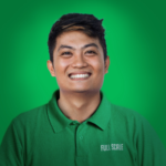 A person smiling, wearing a green "FULL SCALE" polo shirt, stands in front of a green background—ready to help you hire RESTful API developers for your next project.