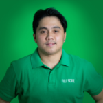 A man in a green "Full Scale" polo shirt stands in front of a green background, representing a team where you can hire API developers for secure and efficient projects.